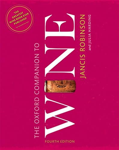 Book cover of "The Oxford Companion to Wine" by Jancis Robinson and Julia Harding, fourth edition. The cover is pink with a wine cork image between the words placed vertically.