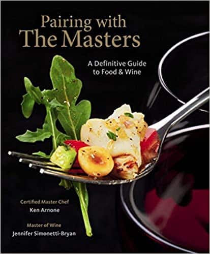 Cover of "Pairing with The Masters: A Definitive Guide to Food & Wine" featuring a fork with food next to a glass of red wine. Authors: Certified Master Chef Ken Arnone and Master of Wine Jennifer Simonetti-Bryan.